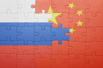Fototapeta premium puzzle with the national flag of russia and china