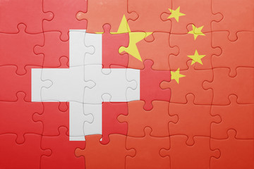 puzzle with the national flag of switzerland and china