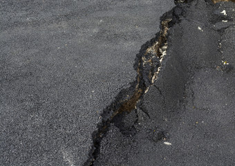 Asphalt surface was demolished due to poor construction.