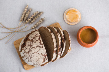 Tasty and delicious sliced loaf of bread on a board. Bread is on