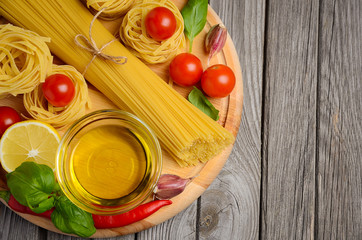 Pasta, vegetables, herbs and spices for Italian food. Top view.