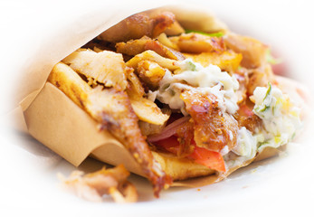 Close-up of greek Pita Gyros on white background.