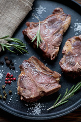 Close-up of grilled lamb T-bone steaks, selective focus
