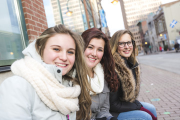 teenage girl friends have fun in city outdoors
