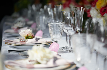 Table setting set with candles and flowers