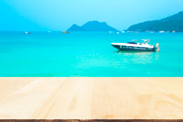 Plank wood or table top with blurred seascape : Suitable use for montage or display your product.