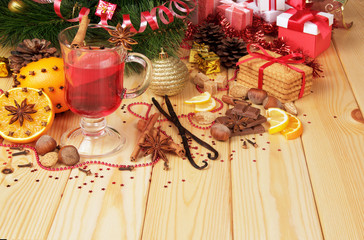 Mulled wine with sugar and spice on a background of Christmas to