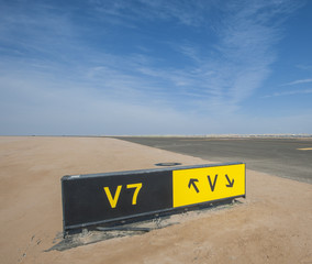 Directional sign markings by a runway
