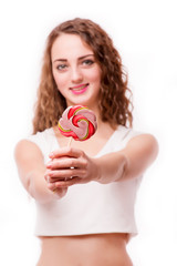 Teen girl with candy in hands / concept of attractive girl holding with fruits on white background