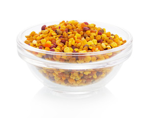 Bee pollen in the bowl on white background