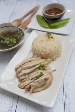 Closeup boil chicken with rice and clear soup with spicy thai style sauce