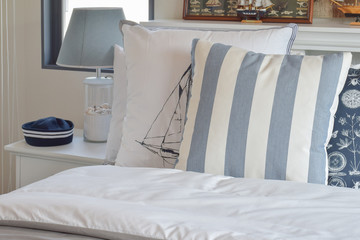 modern bedroom interior with green striped pillow on bed and dec