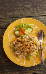 Thai style fried noodle with chicken and vegetable