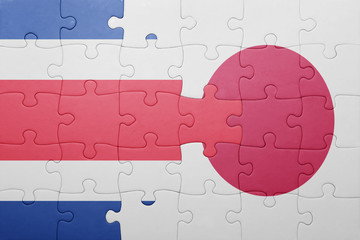 puzzle with the national flag of costa rica and japan
