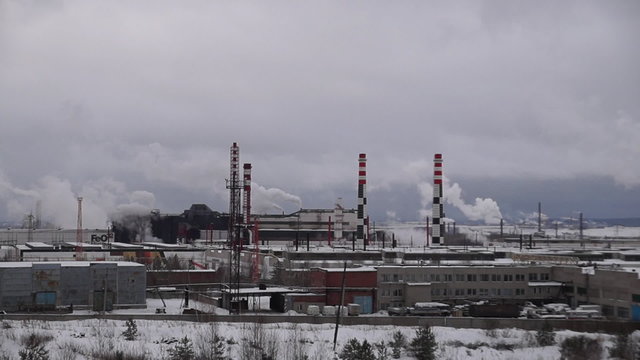 winter smoke from the chimneys of the plant