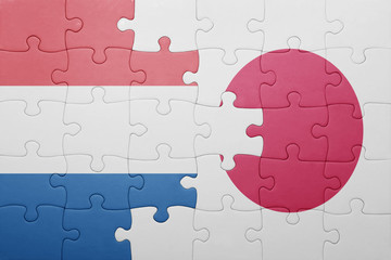 puzzle with the national flag of netherlands and japan