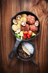 Grilled Hamburgers with  Vegetables served in a Pan