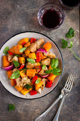 Roasted pumpkin, meat, bell peppers and red onion