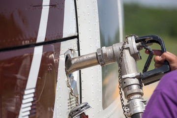 hand hold fuel nozzle fill the gas to helicopter