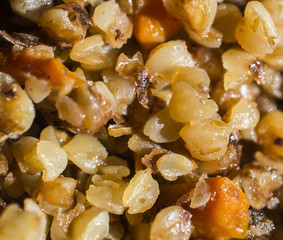 Friable stewed hot buckwheat cereal close up