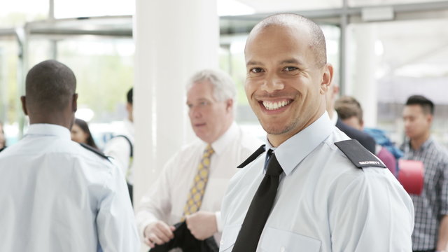  Portrait of smiling airport security guard on duty