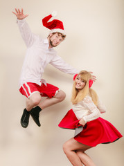 Obraz premium Happy active couple dancing and jumping.