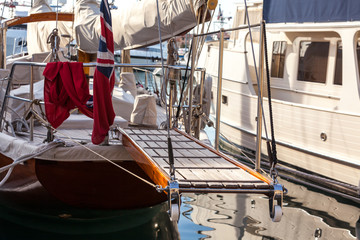 Fototapeta na wymiar wooden ladder on marine yacht staying in port