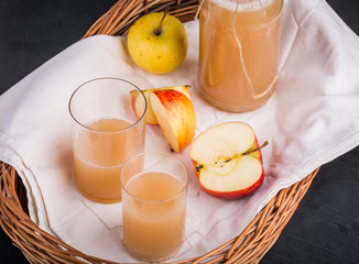 Fresh apple juice in a bottle and in a glass
