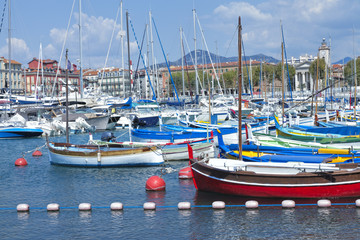 Fototapeta premium Fishing boats, super yachts in sea marina in Nice Port French Riviera on sunny summer day