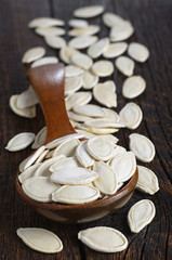 Pumpkin seeds in wooden spoon