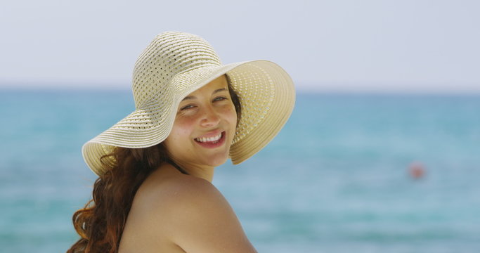  Portrait of a beautiful woman relaxing alone at the beach. 