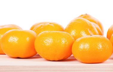A mandarine on wooden table.