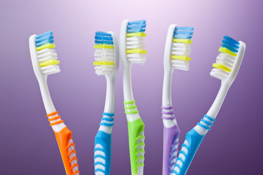 a group of colorful toothbrushes