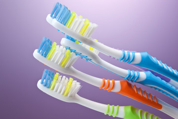 a group of colorful toothbrushes