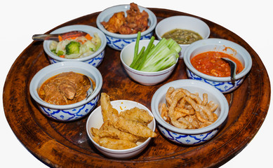 Chinese or Thai food on a rotating tablet-isolated