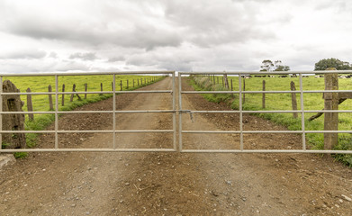 an iron gate to a farm