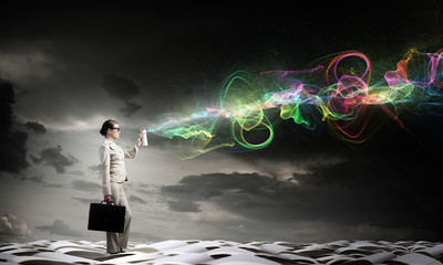 Woman spraying colors