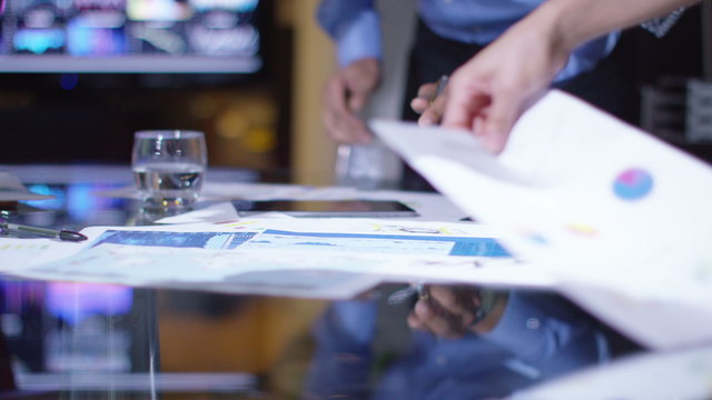  Business group in a meeting looking over the company figures