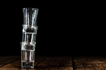 Pile of empty shot glasses