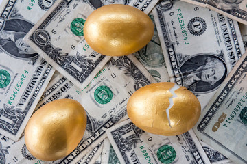 Three golden eggs, one broken
