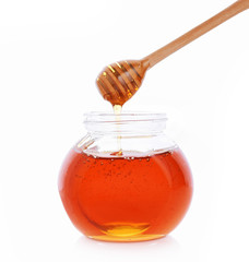 Wooden Spoon honey, honey jar on white background