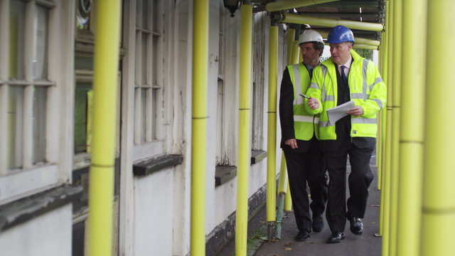  Engineers or architects conducting an inspection on construction site