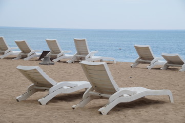 Fototapeta na wymiar White beach chairs