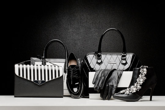 beautiful set of women's fashion accessories on black background