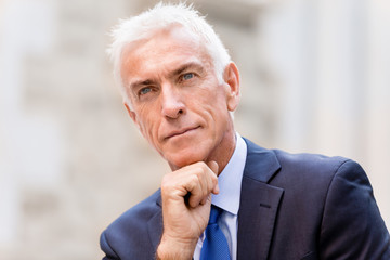 Portrait of confident businessman outdoors