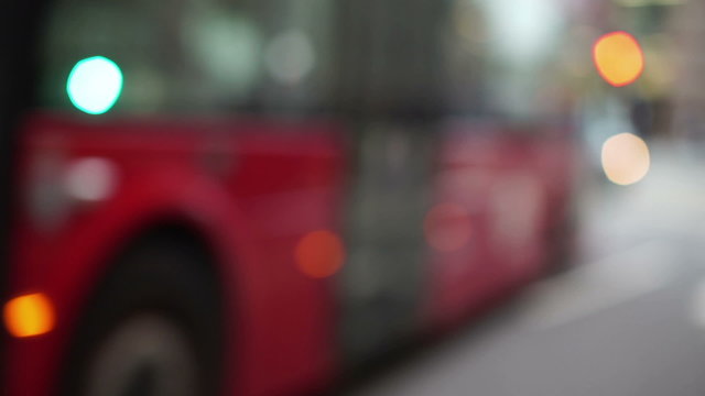 London's distinctive red buses, black cabs and other vehicles driving through city