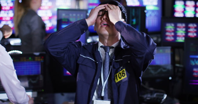  stressed city financial trader reacts as he watches the markets crash