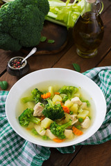 Chicken soup with broccoli, green peas, carrots and celery 