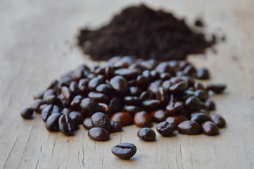 coffee bean and powder on wooden board