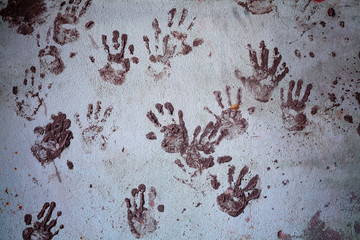 Prints of hands on the old wall
